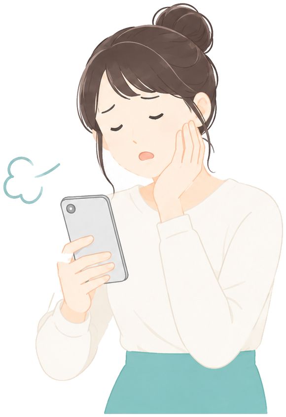 スマホを見てため息をつく女性